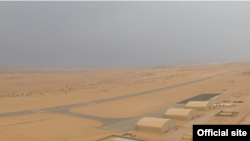 Hangars and an airstrip are seen at a new U.S.-constructed air base at a remote desert location in Niger (screengrab from U.S. Department of Defense video)