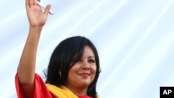 Gisela Mota waves during her swearing in ceremony as mayor of Temixco, Morelos State, Mexico, Jan. 1, 2016. 