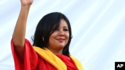 FILE - Gisela Mota waves during her swearing in ceremony as mayor of Temixco, Morelos State, Mexico, Jan. 1, 2016. 