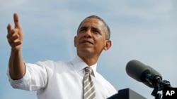 President Barack Obama speaks about the government shutdown and debt ceiling during a visit to to M. Luis Construction in Rockville, Maryland, Oct. 3, 2013.