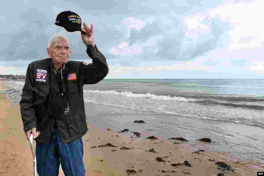 US WWII veteran Loren Kissick from Puyallup, Washington, pays his respects as he stands on Omaha Beach in Saint-Laurent-sur-Mer, Normandy, northwestern France, as part of D-Day commemorations marking the 75th anniversary of the World War II Allied landings in Normandy.