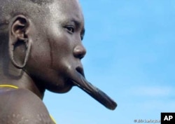 The most well-known of the Omo River tribes are the Mursi, whose women use plates to extend their lips