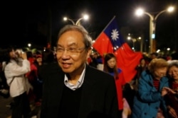 FILE - Hong Kong academic and activist Joseph Cheng observes a Kuomintang (KMT) rally ahead of the election in Taipei, Taiwan, January 9, 2020.