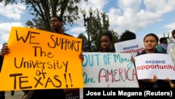 Students calling for diversity protest outside the U.S. Supreme Court in Washington October 10, 2012.