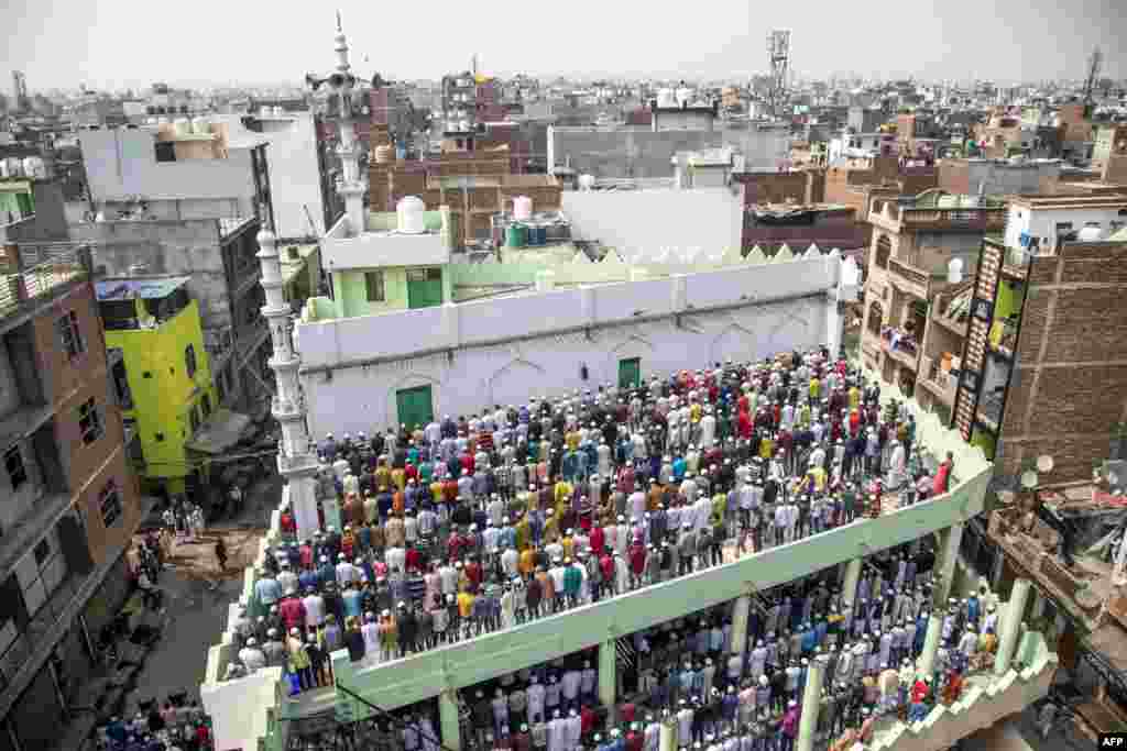 Muslim devotees offer Friday prayers at a mosque following sectarian riots over India&#39;s new citizenship law, at Mustafabad area in New Delhi. 
