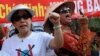 FILE - Bui Thi Minh Hang (R), 47, shouting anti-China slogans next to dissident lawyer Cu Huy Ha Vu's wife, Nguyen Thi Duong Ha (L), during an anti-China protest in downtown Hanoi.