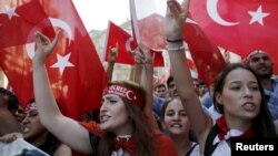 Demonstrators wave Turkish flags as they shout nationalist slogans during a protest against Kurdistan Workers' Party (PKK) in central Istanbul, August 16, 2015. 