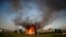 A shack home burns as people are evicted from a squatters camp by police in Guernica, Buenos Aires province, Argentina. Evicted families say they have nowhere to go amid the COVID-19 pandemic.