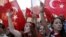 FILE - Demonstrators wave Turkish flags as they shout nationalist slogans during a protest against Kurdistan Workers' Party (PKK) in central Istanbul, Aug. 16, 2015. 