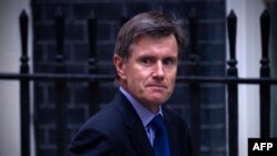 FILE - John Sawers, then chief of Britain's foreign intelligence service MI6, arrives at Downing Street ahead of a meeting of the National Security Council, in central London, Aug. 28, 2013.
