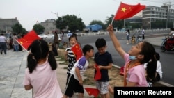 Ahead of a rehearsal for the celebrations to mark the 100th founding anniversary of the Communist Party of China, in Beijing, June 28, 2021.