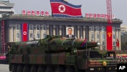 A North Korean vehicle carrying a missile is seen by during a military parade in Pyongyang, April 15, 2012.