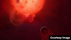The planet Kepler-438b is shown here in front of its violent parent star. It is regularly irradiated by huge flares of radiation, which could render the planet uninhabitable. Here the planet’s atmosphere is shown being stripped away.