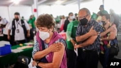 Elderly people are seen after receiving a dose of the CoronaVac vaccine against COVID-19 at a vaccination center in Mexico City, on March 17, 2021.