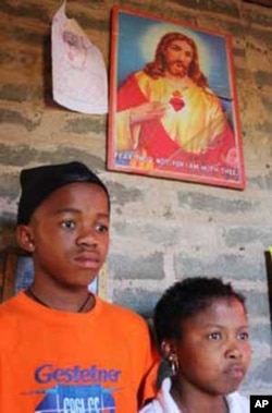 Lerato Tsamai (right), with her younger brother in their home in Freedom Square, Mangaung. She, too, couldn't acess ARVs, but her life was saved when an NGO gave her the medicine