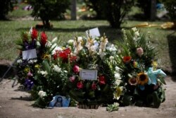 Flowers are seen where Oscar Alberto Martinez Ramirez and his daughter Valeria, migrants who drowned in Rio Grande river during their journey to the U.S., where buried at La Bermeja cemetery in San Salvador, El Salvador, July 1, 2019.