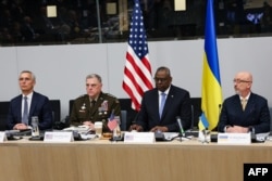 (From L) NATO Secretary General Jens Stoltenberg, US Chairman of the Joint Chiefs of Staff US General Mark A Milley, US Secretary of Defense Lloyd Austin and Ukraine's Minister of Defence Oleksiy Reznikov attend a meeting at the NATO headquarters in Bruss