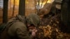 FILE - A serviceman of the 13th Brigade of the National Guard of Ukraine fires a Giatsint-B gun towards Russian positions near Kharkiv, Ukraine, on Nov. 6, 2024. 