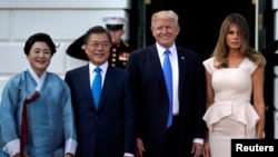 U.S. President Donald Trump and first lady Melania Trump welcome South Korean President Moon Jae-in and his wife Kim Jeong-sook to the White House in Washington, U.S., June 29, 2017. 