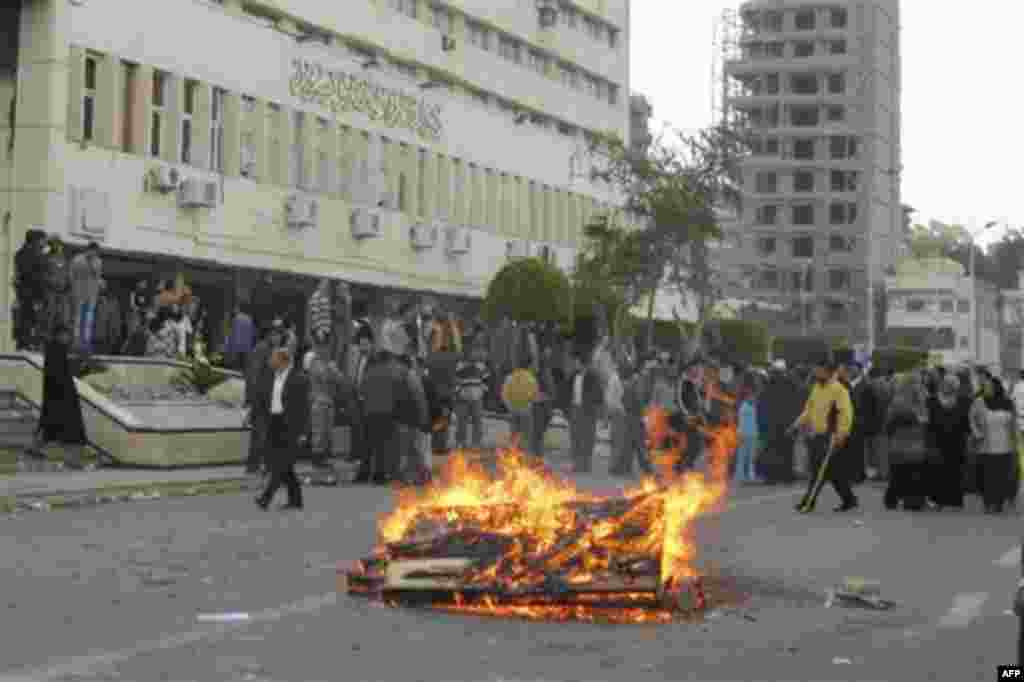 Egyptian protesters, who claim delays for their requests for housing, start a fire in front of local government headquarters Port Said Egypt, Thursday, Feb. 10, 2011. Labor unrest across the country gave powerful momentum to Egypt's wave of anti-governm