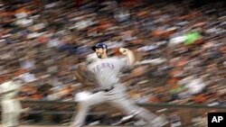 Texas Rangers' Cliff Lee throws during the second inning of Game 1 of baseball's 2010 World Series against the San Francisco Giants.