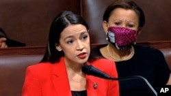 FILE - Rep. Alexandria Ocasio-Cortez, D-N.Y., speaks on the House floor on Capitol Hill in Washington, July 23, 2020.
