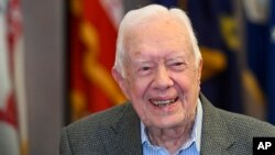 FILE - Former President Jimmy Carter, 93, sits for an interview before a book signing in Atlanta, April 11, 2018. 
