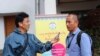 FILE - Gyaltsen Choedak, VOA Tibetan Service, is seen working at a conference in 2018. Many journalists reporting on events inside Tibet rely on messaging apps and sources who risk prison and retaliation against their families for speaking out. 