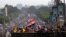 Supporters of Egypt's ousted President Mohamed Morsi stand on a bridge as they march during his trial in Cairo, Egypt, Nov. 4 2013.