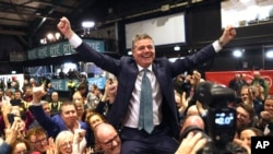 Fine Gael politician Paschal Donohoe celebrates with supporters at RDS, the Royal Dublin Society, after voters went to the polls during Ireland's election in Dublin, Dec. 1, 2024.