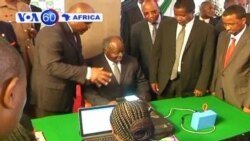 With elections coming in March, Kenyan President Kibaki is first to register on new biometric voter registration machines.