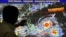 Forecaster Meno Mendoza shows the path of Super Typhoon Mangkhut, locally named "Typhoon Ompong," as it approaches the Philippines at the Philippine Atmospheric, Geophysical and Astronomical Services Administration in Manila, Sept. 12, 2018.