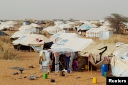 FILE - Tents set up by the United Nations High Commissioner for Refugees (UNHCR) are seen in a refugee camp for Malians in Mbera, Mauritania, about 40 km (25 miles) from the border with Mali, May 23, 2012.