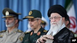 In this picture released by an official website of the office of the Iranian supreme leader, Ayatollah Ali Khamenei attends a ceremony in a military academy, in Tehran, June 30, 2018. Khamenei has accused the United States and allies of fomenting unrest in Iran.