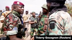 Lieutenant Colonel Cherif Ousmane greets mutinous soldiers at the airport in Bouake, Ivory Coast, Jan. 13, 2017. 