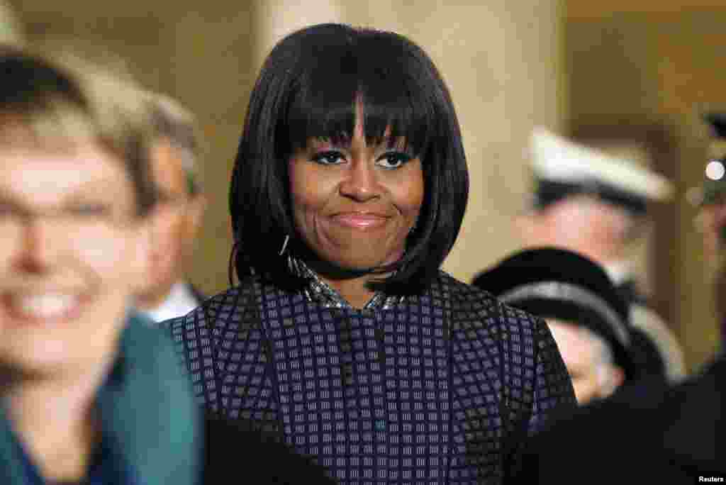 First lady Michelle Obama walks through the crypt on her way to watch her husband, President Barack Obama, get sworn-in for a second term by Supreme Court Chief Justice John Roberts during his public inauguration ceremony at the U.S. Capitol Building in W