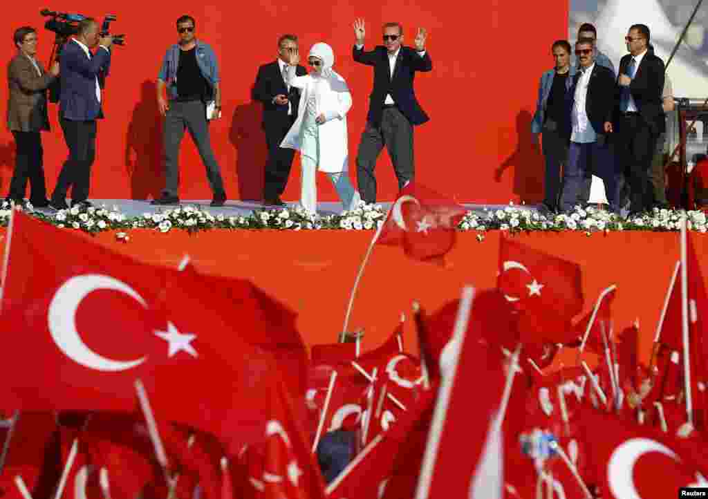 Turkish President Tayyip Erdogan and his wife Emine Gulbaran attend Democracy and Martyrs Rally, organized by him and supported by ruling AK Party (AKP), oppositions Republican People's Party (CHP) and Nationalist Movement Party (MHP), to protest against