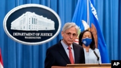 Attorney General Merrick Garland announces in Washington, Aug. 5, 2021, that the Department of Justice is opening an investigation into the city of Phoenix and the Phoenix Police Department.