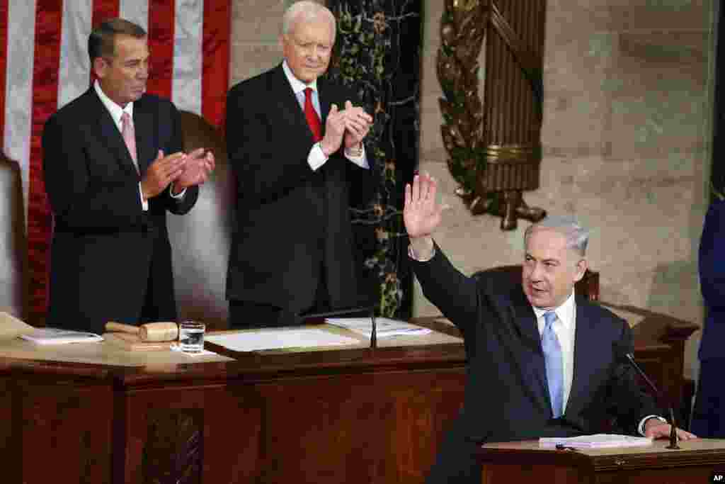 Israeli Prime Minister Benjamin Netanyahu waves as he steps to the podium prior to speaking before a joint meeting of Congress on Capitol Hill in Washington, March 3, 2015.