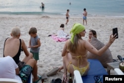 Russian tourists enjoy at Layan beach in Phuket