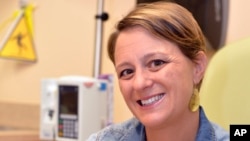 Crowdsourcing Breast Cancer: Lara MacGregor, a participant in a new crowdsourcing project for metastatic breast cancer research, poses for a photo as she undergoes treatment at the Norton Cancer Center in Louisville, Ky., on Wednesday, Sept. 21, 2016. 