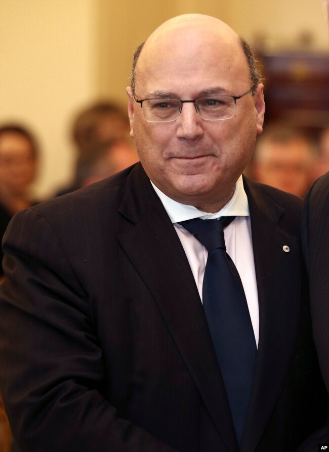 In this July 19, 2016 photo, Arthur Sinodinos is sworn in as Senator for New South Wales by the Governor General Sir Peter Cosgrove at Government House in Canberra, Australia.
