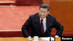 中国国家主席习近平在北京人大会堂参加纪念中国改革开放40年的纪念会。（2018年12月18日）