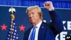 FILE - Republican presidential candidate former President Donald Trump gestures after speaking at a campaign rally Oct. 23, 2023, in Derry, N.H