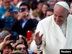 Pope Francis waves to the crowd as he arrives for a holy mass at Simon Bolivar park in Bogota, Colombia, Sept. 7, 2017.