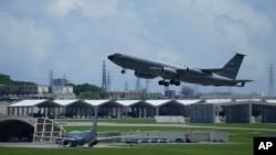 FILE - A U.S. Air Force KC-135 Stratotanker refueling tanker aircraft takes off from the Kadena Air Base in Kadena Town, Okinawa, Japan, on Aug. 30, 2023. U.S. Marines stationed in Okinawa began a partial transfer to Guam on Dec. 14, 2024.