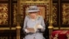 Britain's Queen Elizabeth II delivers a speech in the House of Lords during the State Opening of Parliament at the Palace of Westminster in London, Tuesday May 11, 2021. (Chris Jackson/Pool via AP)