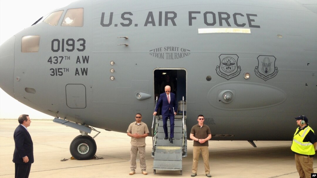 FILE - Then-Vice President Joe Biden steps off a C-17 military transport plane upon his arrival in Baghdad, Iraq, April 28, 2016.