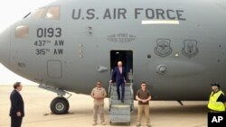 FILE - Then-Vice President Joe Biden steps off a C-17 military transport plane upon his arrival in Baghdad, Iraq, April 28, 2016.