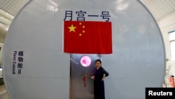 Liu Hong, chief designer of the Lunar Palace 365 Project stands outside a simulated space cabin in which volunteers temporarily live as a part of the project at Beihang University in Beijing, China, July 9, 2017.